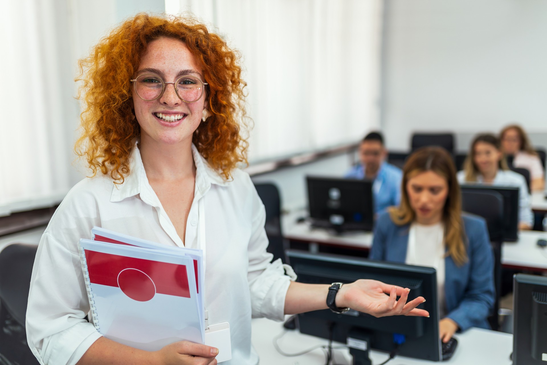 Educator and students in programming school